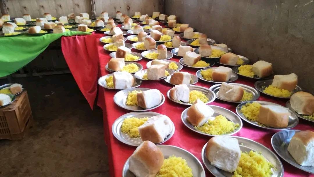Plates of food arranged for a community meal