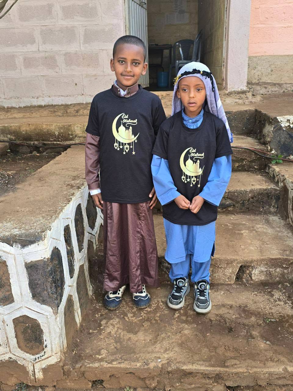 Two children standing together during the Eid celebration